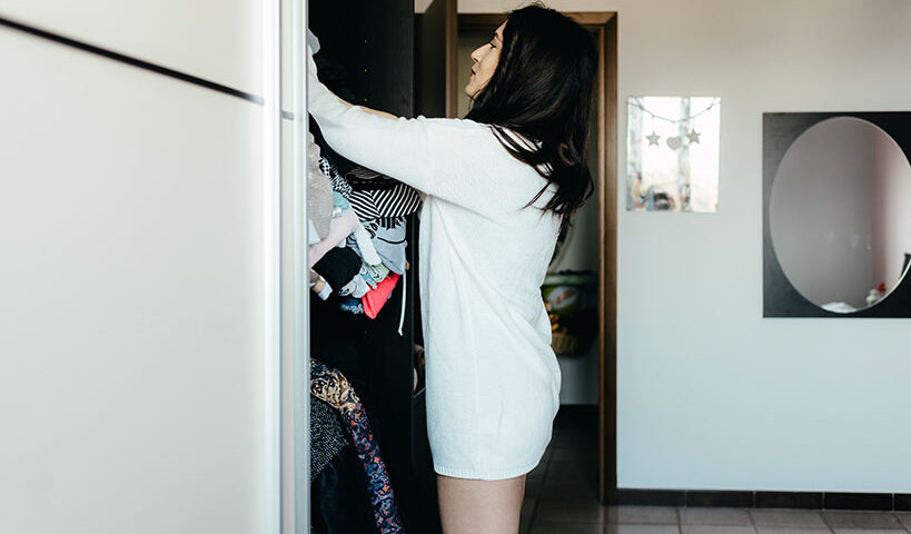 woman organizing her closet